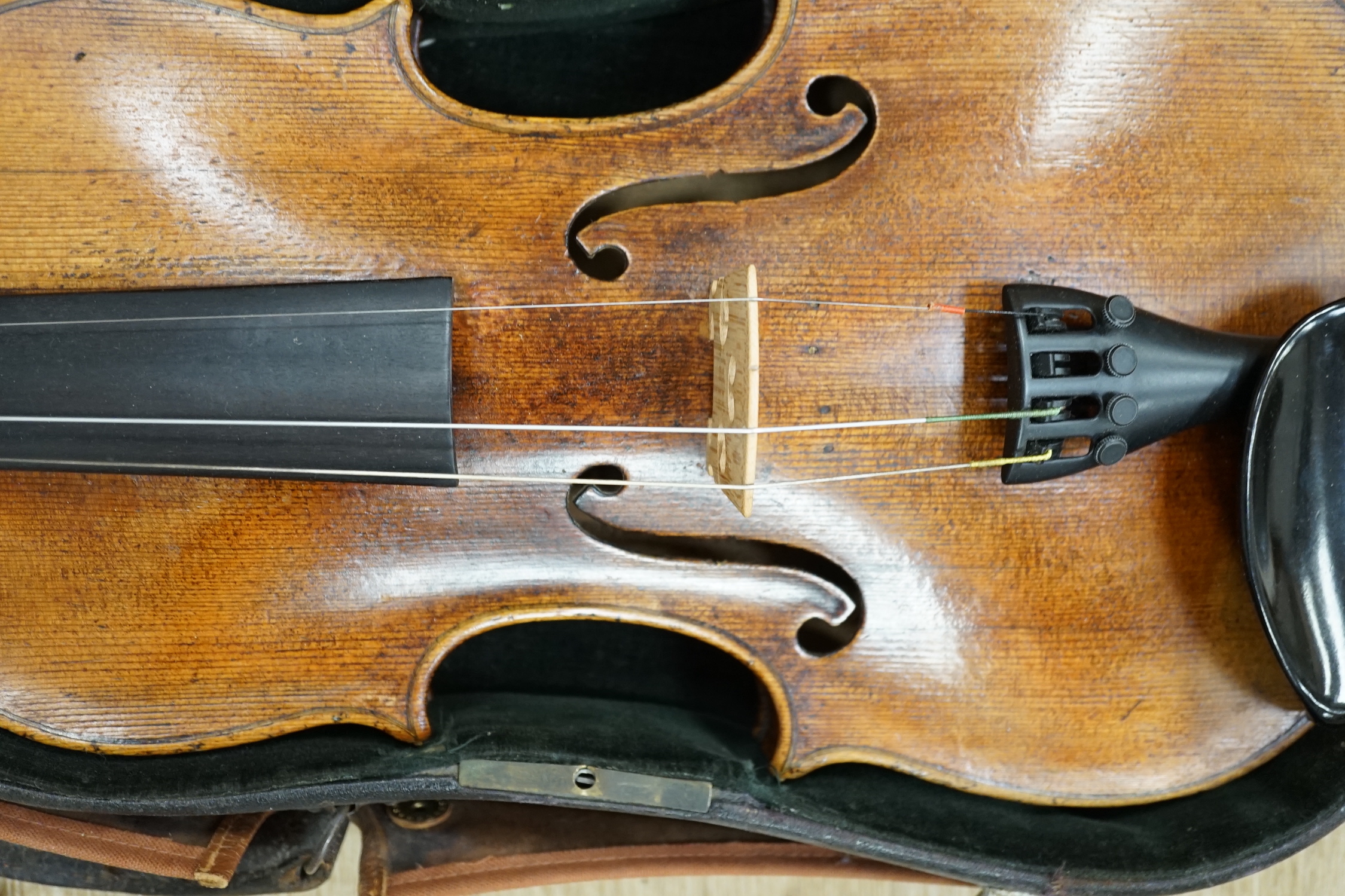 A cased 19th century German violin with paper label for Schweitzer copy Amati Pestini, length of body, 36cm, with bow CITES Submission reference 97BD7MYU